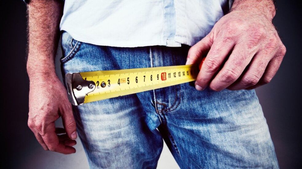 man measuring penis after gel augmentation